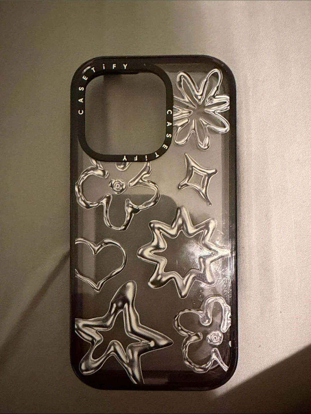 Casetify Black Clear Floral Star-Accent 14pro iPhone Case
